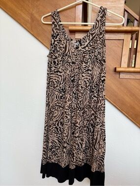 NWOT Super cute Sleeveless Animal Print Swing Dress in Tan and Black flattering